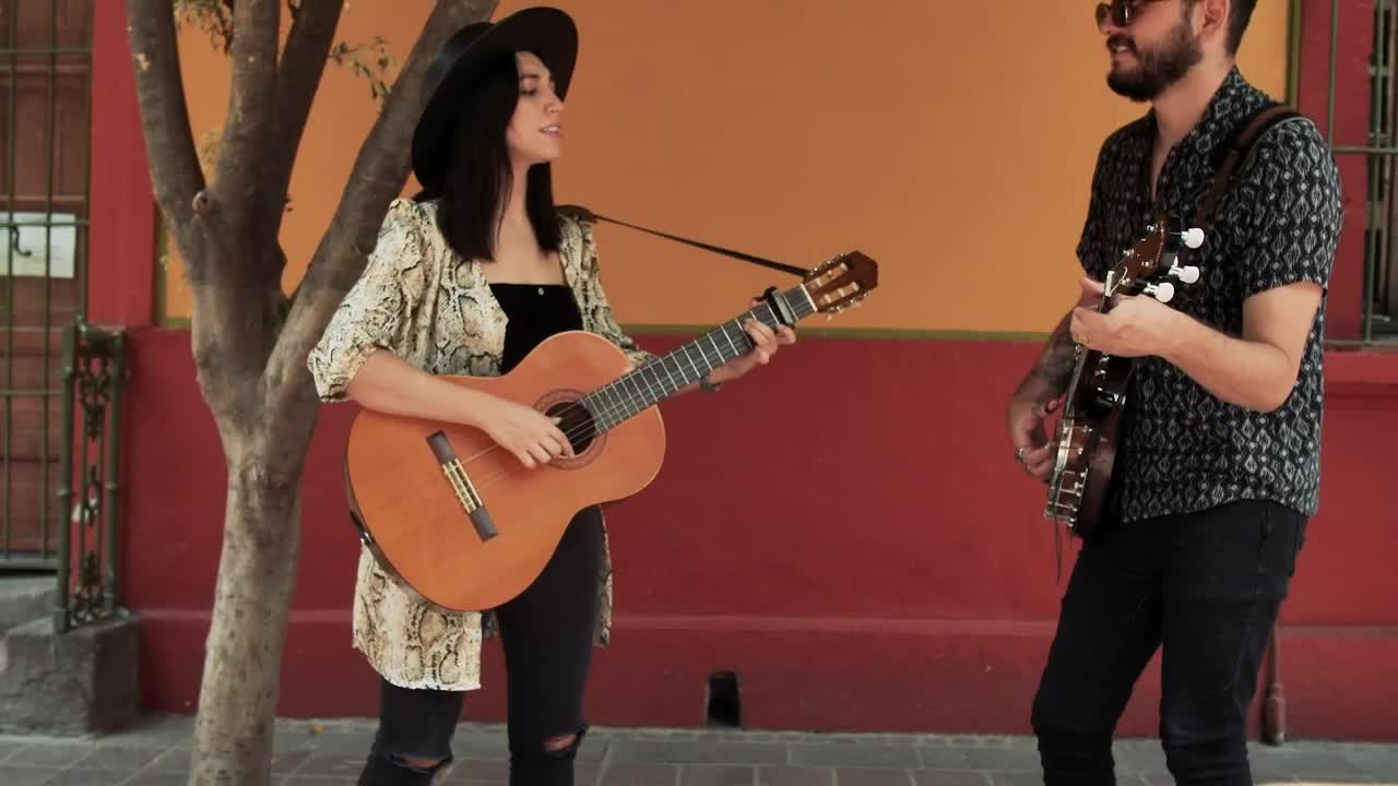 Stock Video Man And Woman Playing Music On The Street Asking For Animated Wallpaper - Free Download