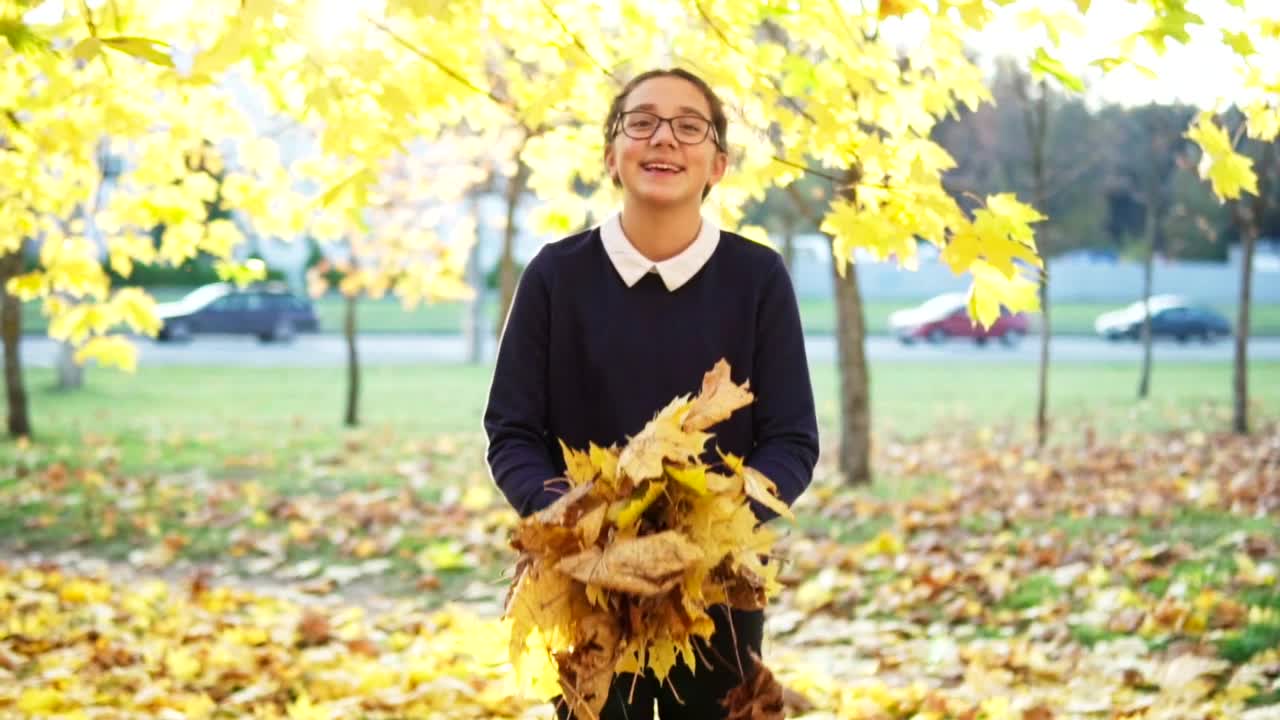 Stock Video Girl Throwing Autumn Leaves Live Wallpaper For PC - Free Download