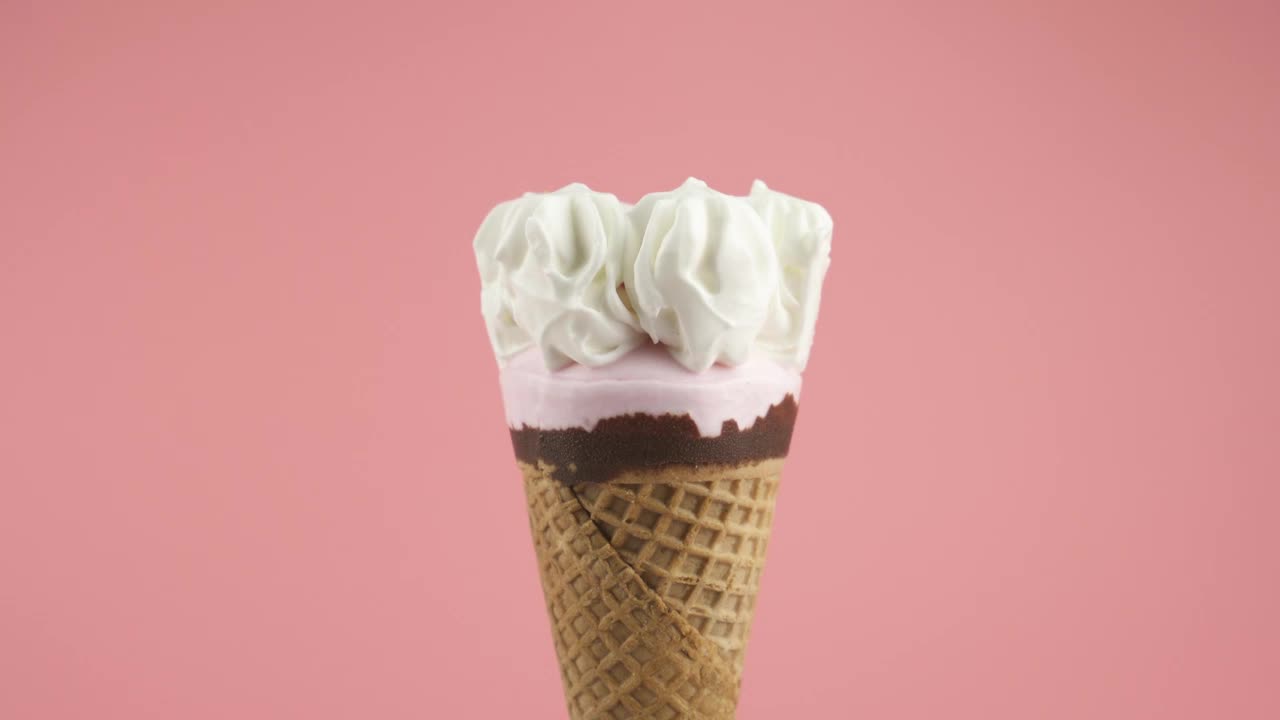 Stock Video Ice Cream Cone With Syrup On A Pink Background Animated Wallpaper - Free Download