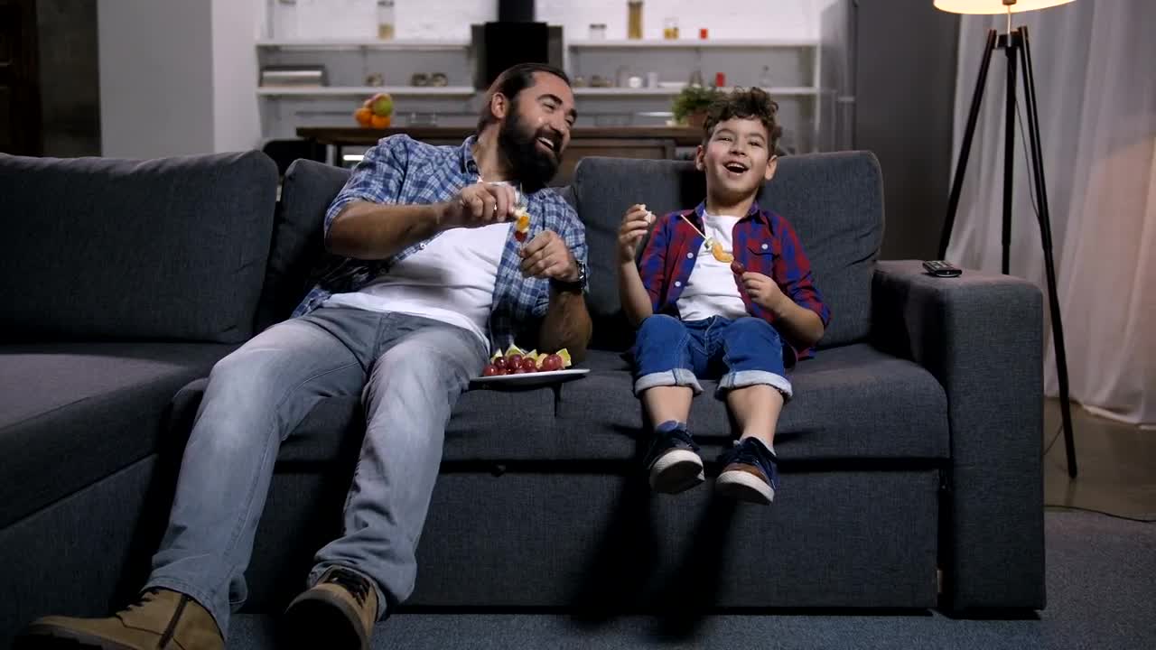Stock Video Father And Son Laughing At The Tv Live Wallpaper For PC - Free Download