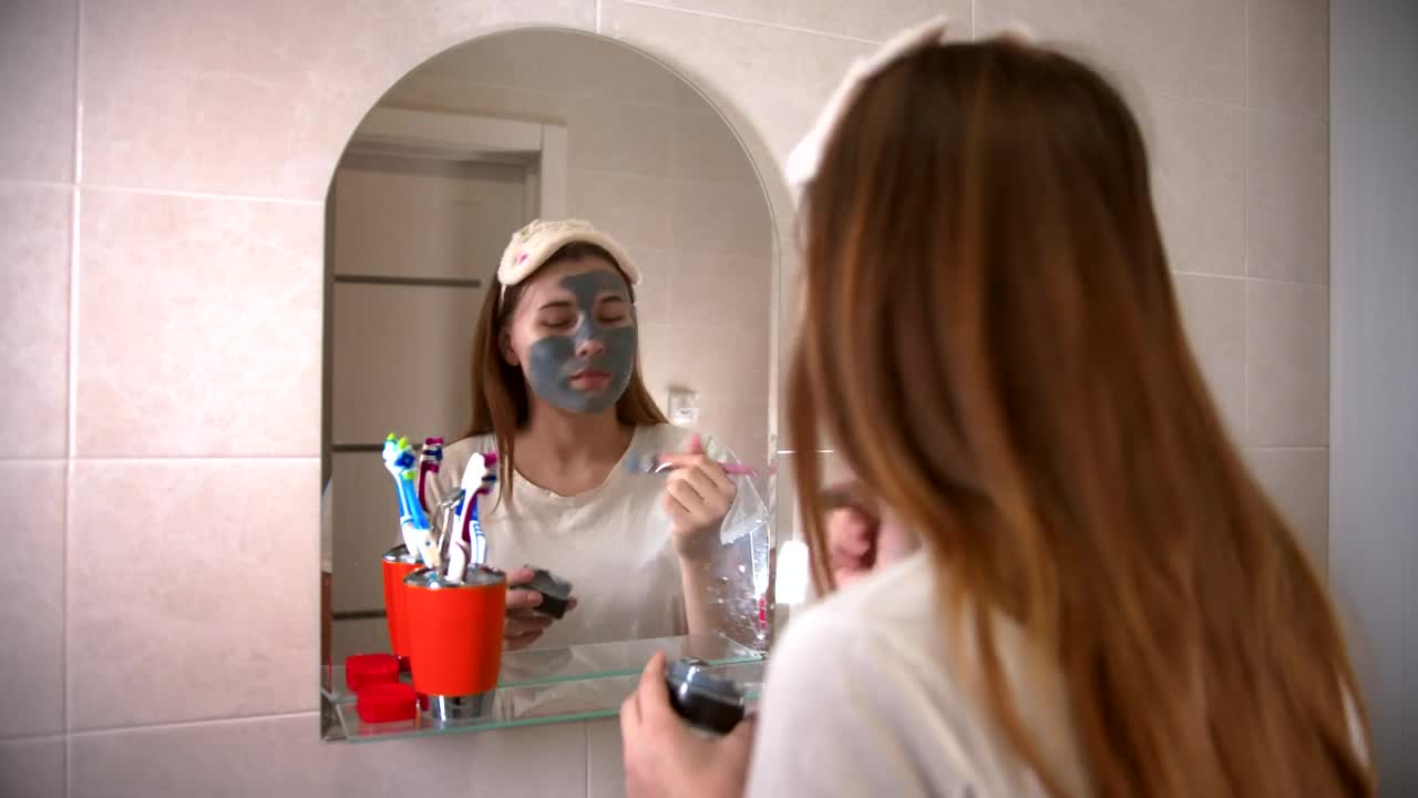 Stock Video Girl Applying A Mask In Front Of A Mirror Live Wallpaper For PC - Free Download