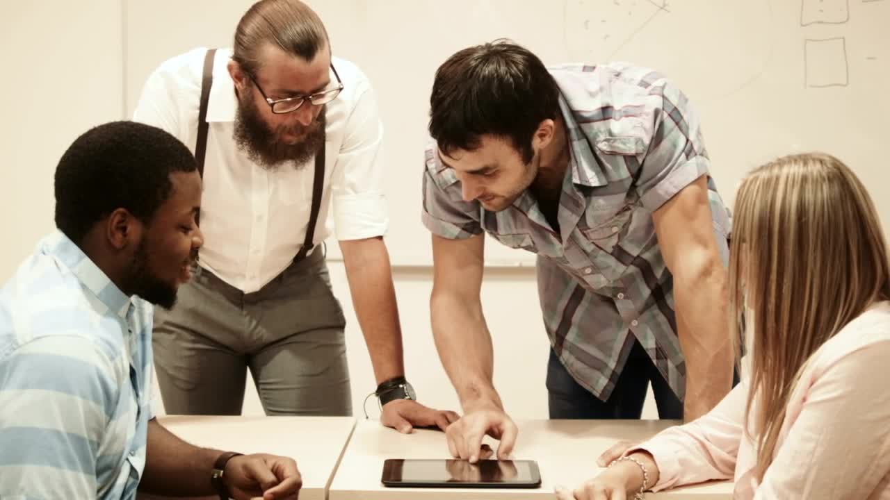 Stock Video College Team Checking Information On A Tablet Live Wallpaper For PC - Free Download
