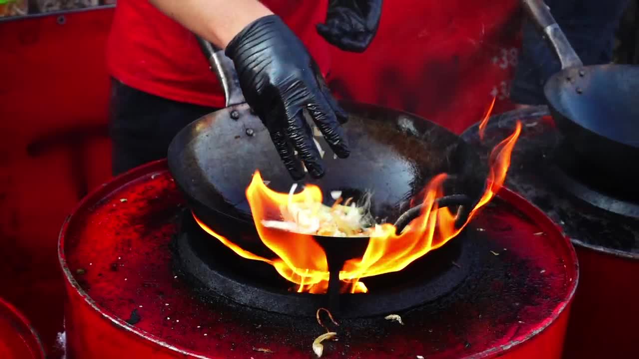 Stock Video Person Cooking In A Wok Pan With High Flame Live Wallpaper - Free Download