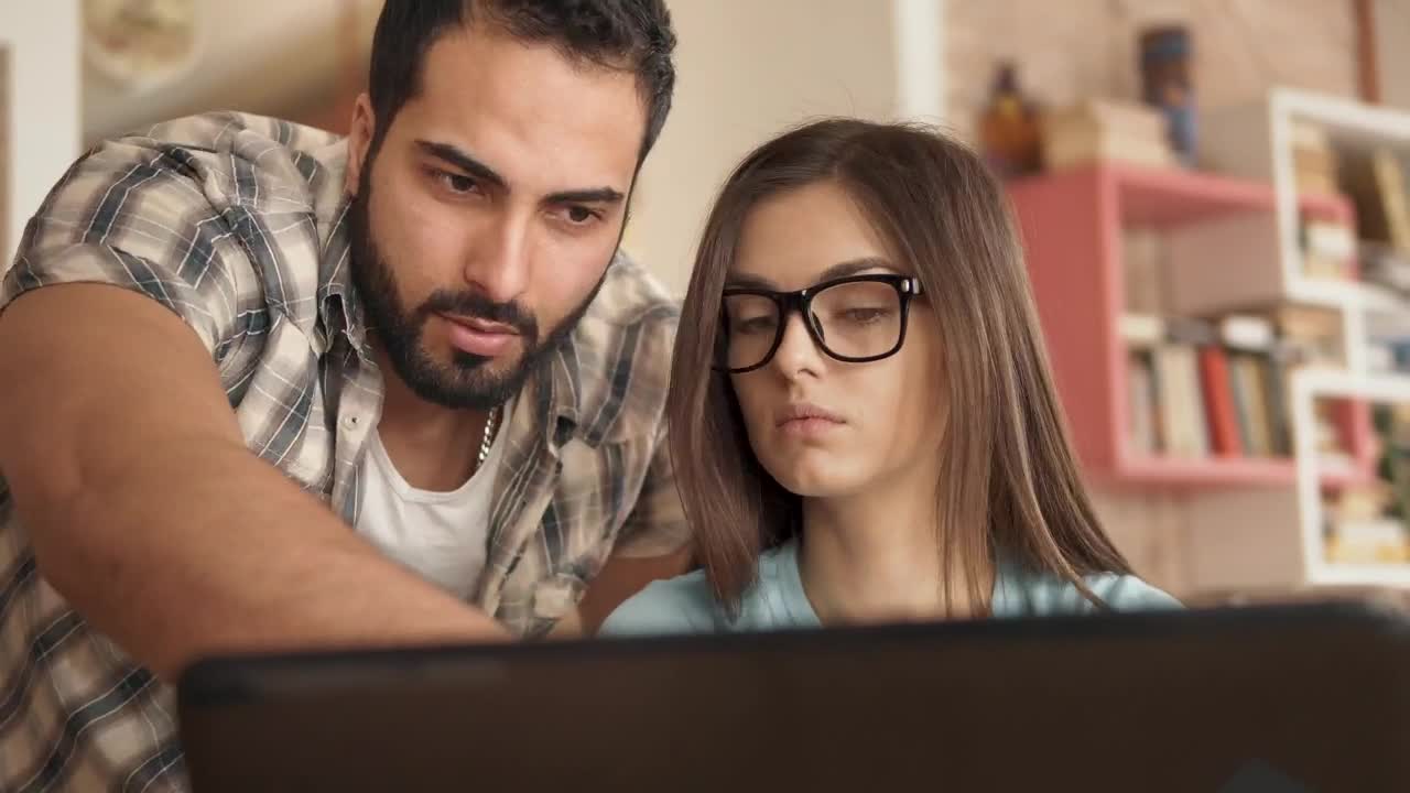 Stock Video Man Explains Idea To Creative Partner And Points At Screen Animated Wallpaper - Free Download