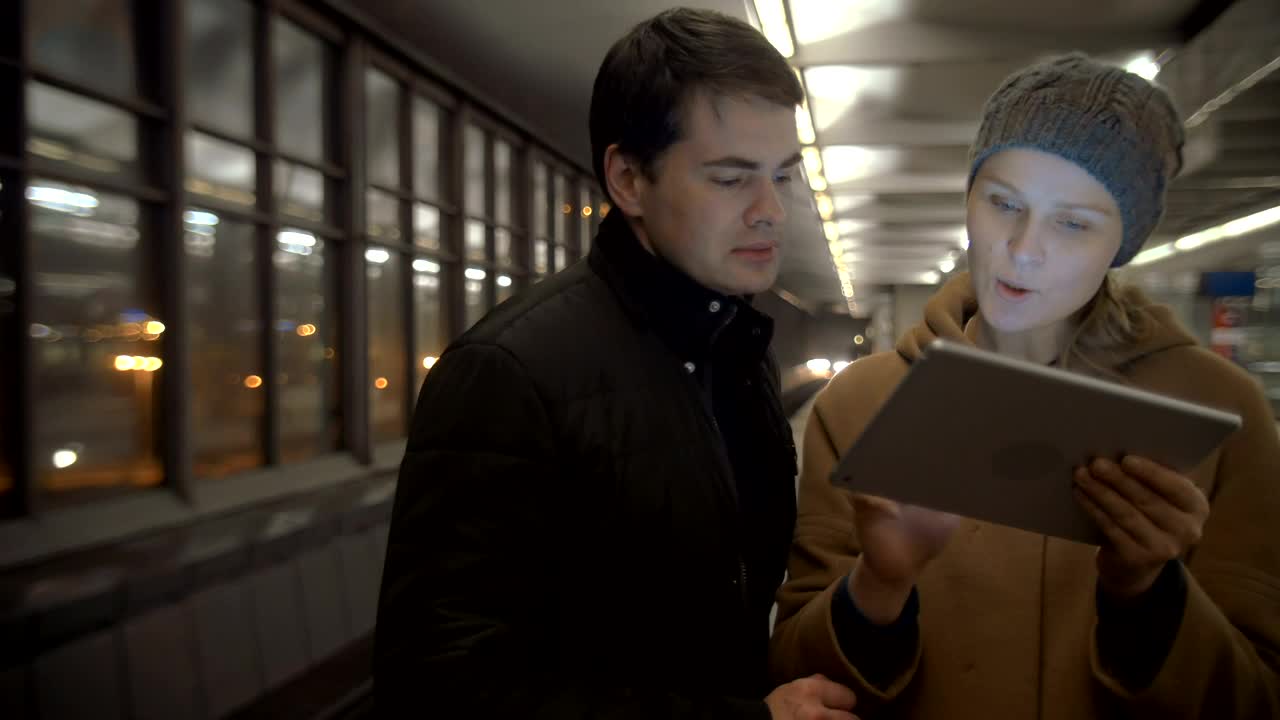 Stock Video Couple Looking For Directions On A Tablet Live Wallpaper For PC - Free Download