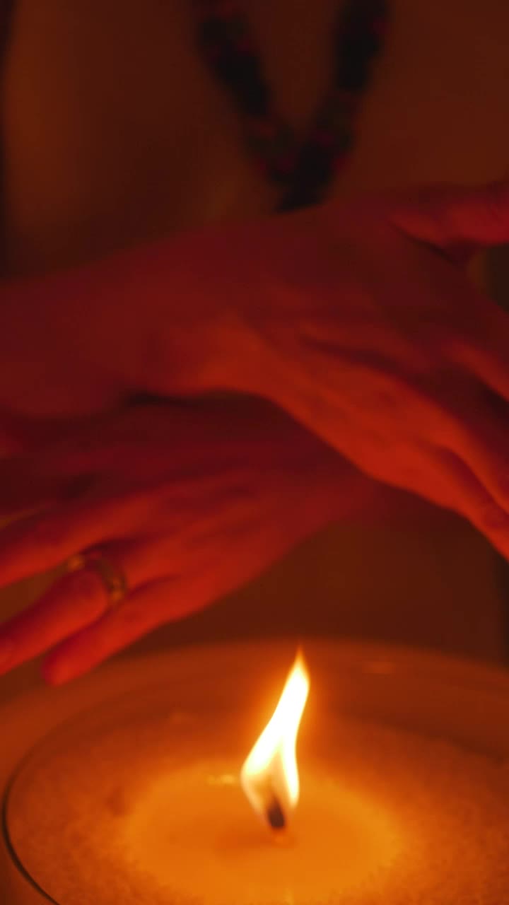 Free Stock Video Woman Passing Her Hands Near The Flame Of A Candle Live Wallpaper - Free Download