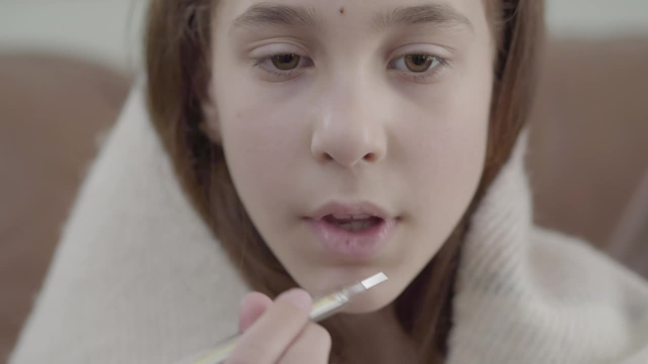Stock Video Girl Wrapped In Blanket Puts Thermometer In Mouth Live Wallpaper For PC - Free Download