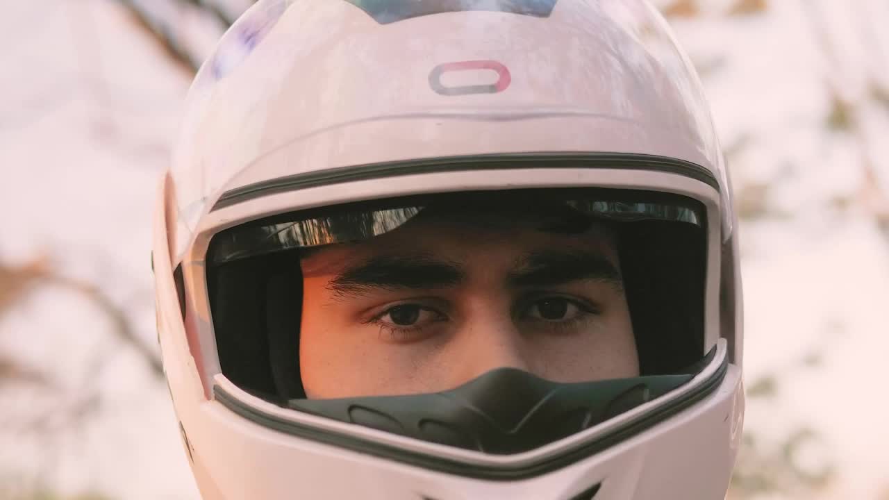 Stock Video Face Of A Motorcycle Rider With A Helmet Putting On Live Wallpaper For PC - Free Download