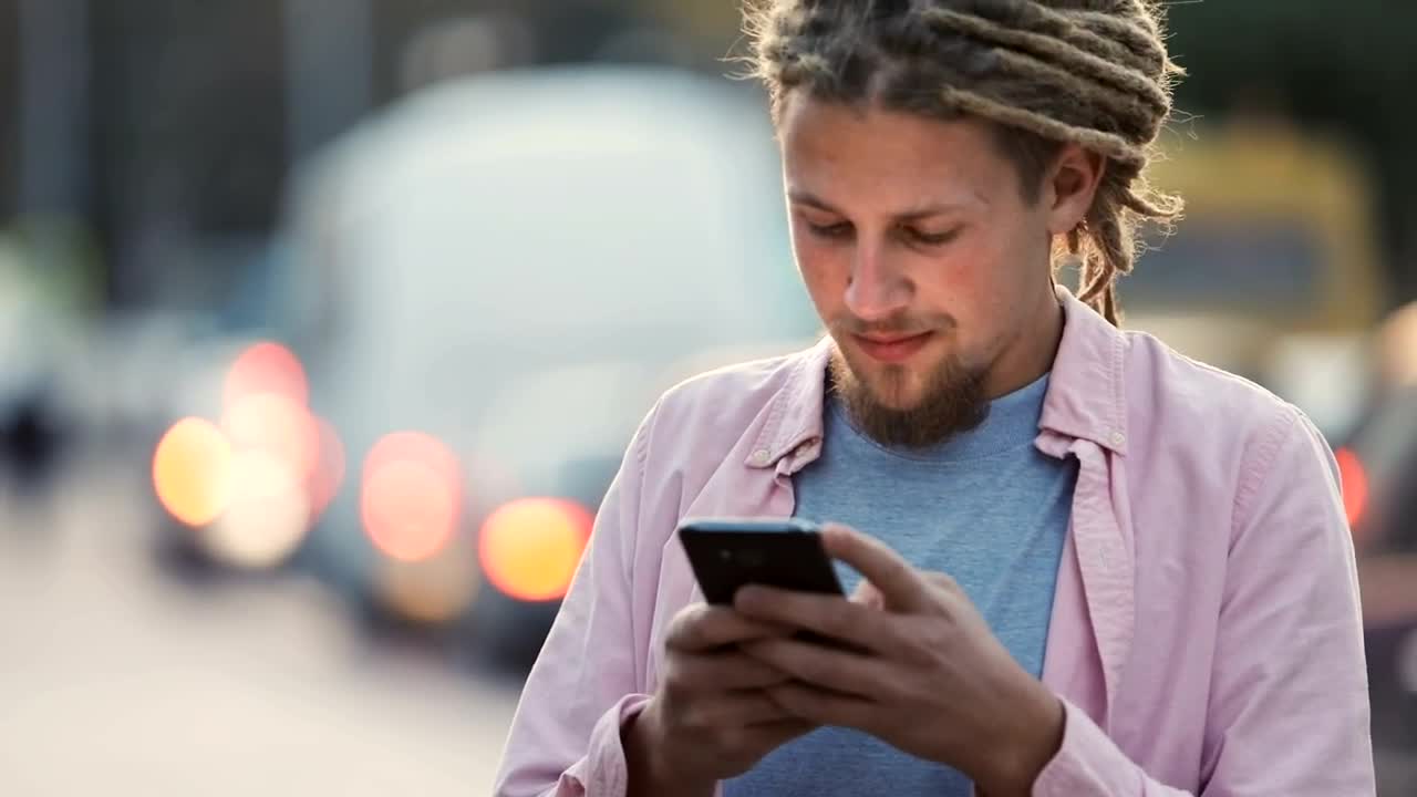 Stock Footage Urban Man Smiles At Social Media App In Street Live Wallpaper - Free Download