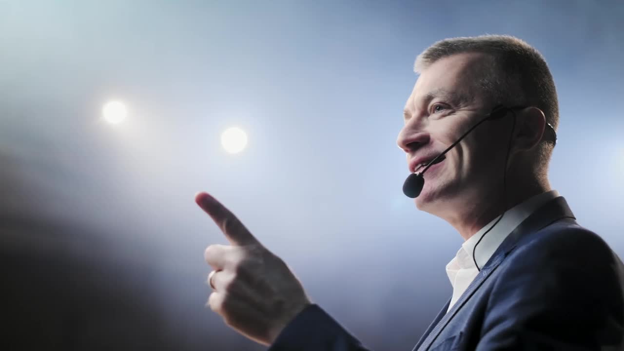 Free Video Stock Successful Lecturer Speaks Passionately On Stage Live Wallpaper - Free Download