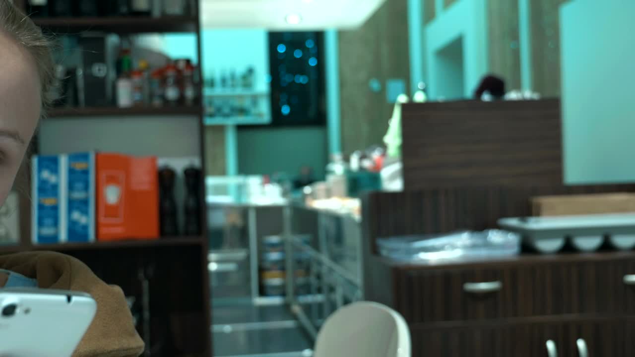 Free Video Stock texting from a modern cafe Live Wallpaper - Free Download