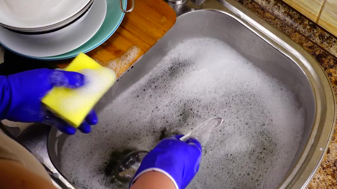 Stock Footage Washing Cutlery In A Sink Live Wallpaper - Free Download