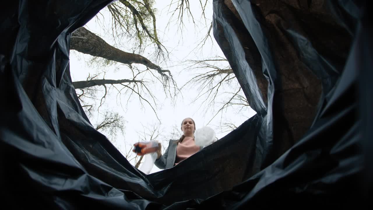 Free Video Stock throwing garbage in a bag Live Wallpaper - Free Download