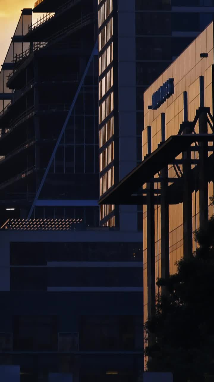 Stock Video High Skyscrapers Of A City During Sunset Animated Wallpaper - Free Download