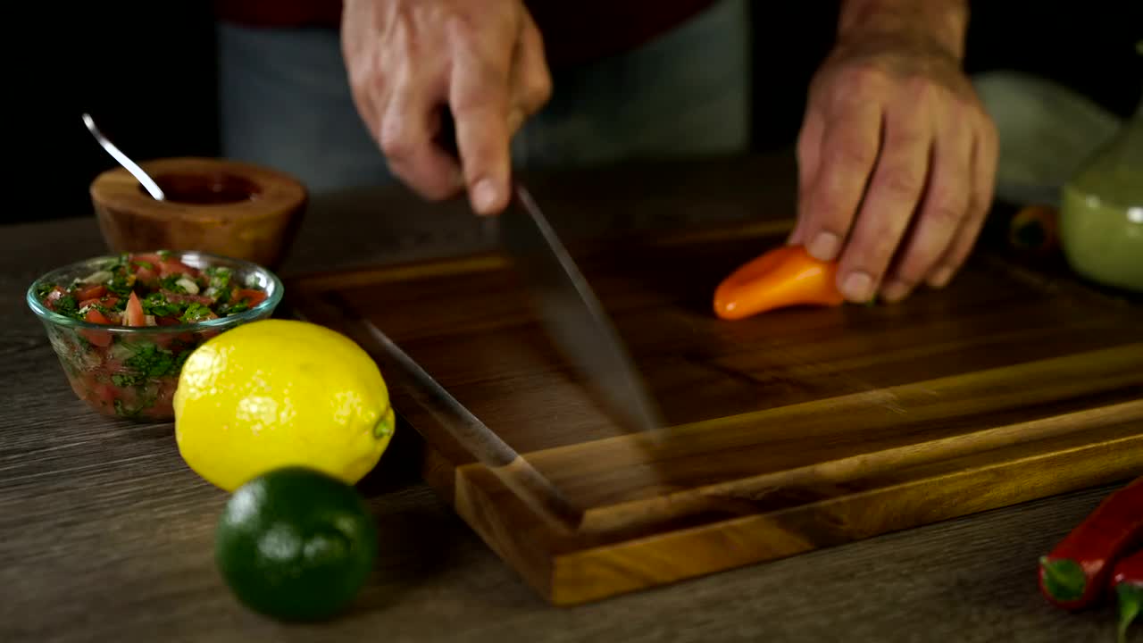 Stock Video Cutting Up An Orange Pepper Live Wallpaper For PC - Free Download