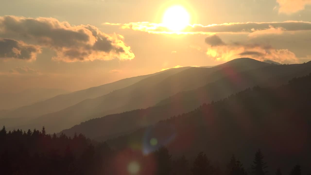 Free Video Stock sunset in the mountains seen from afar Live Wallpaper - Free Download