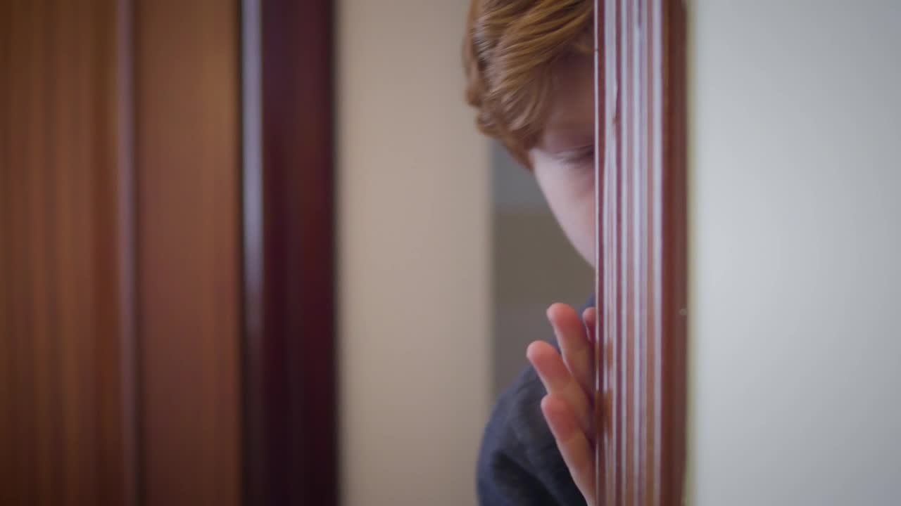 Stock Video Little Boy Peeks Around Corner In Fear Animated Wallpaper - Free Download