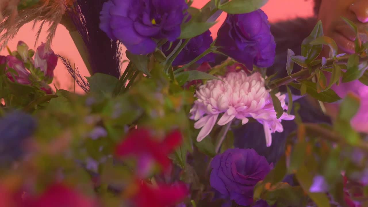 Stock Video Lgbtq Man Taking A Flower In A Pink Setting Animated Wallpaper - Free Download