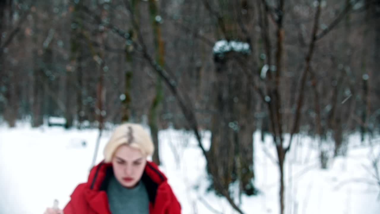Free Video Stock tired female skier walks in the snow in the forest Live Wallpaper - Free Download