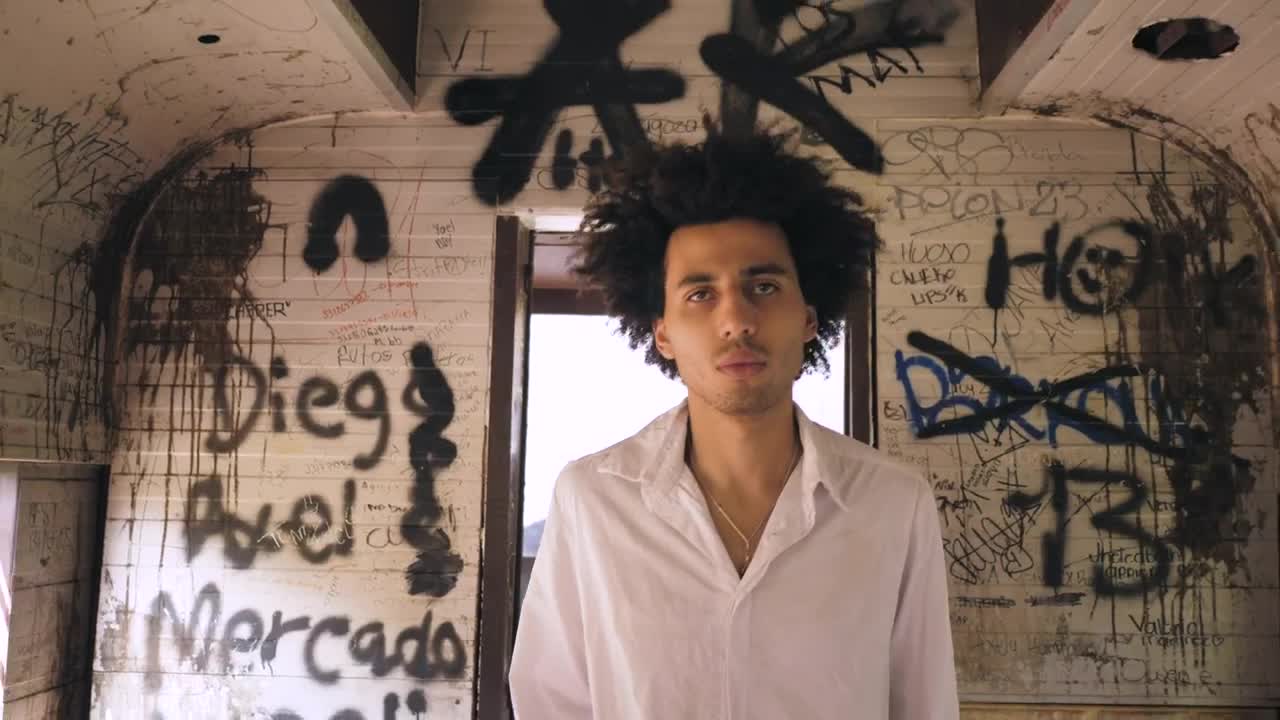 Stock Video Man Walking Through A Graffitied Hal Animated Wallpaper - Free Download