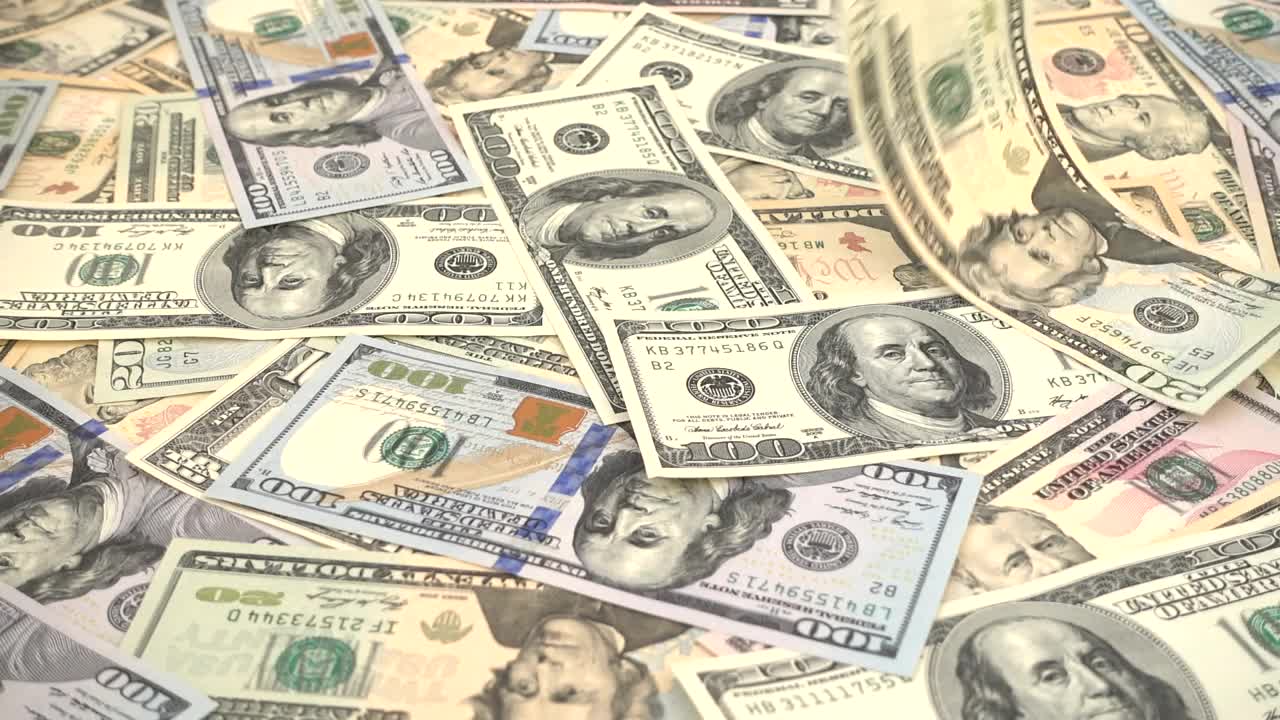 Stock Video Dollars Bills Falling And Covering A Surface Live Wallpaper For PC - Free Download