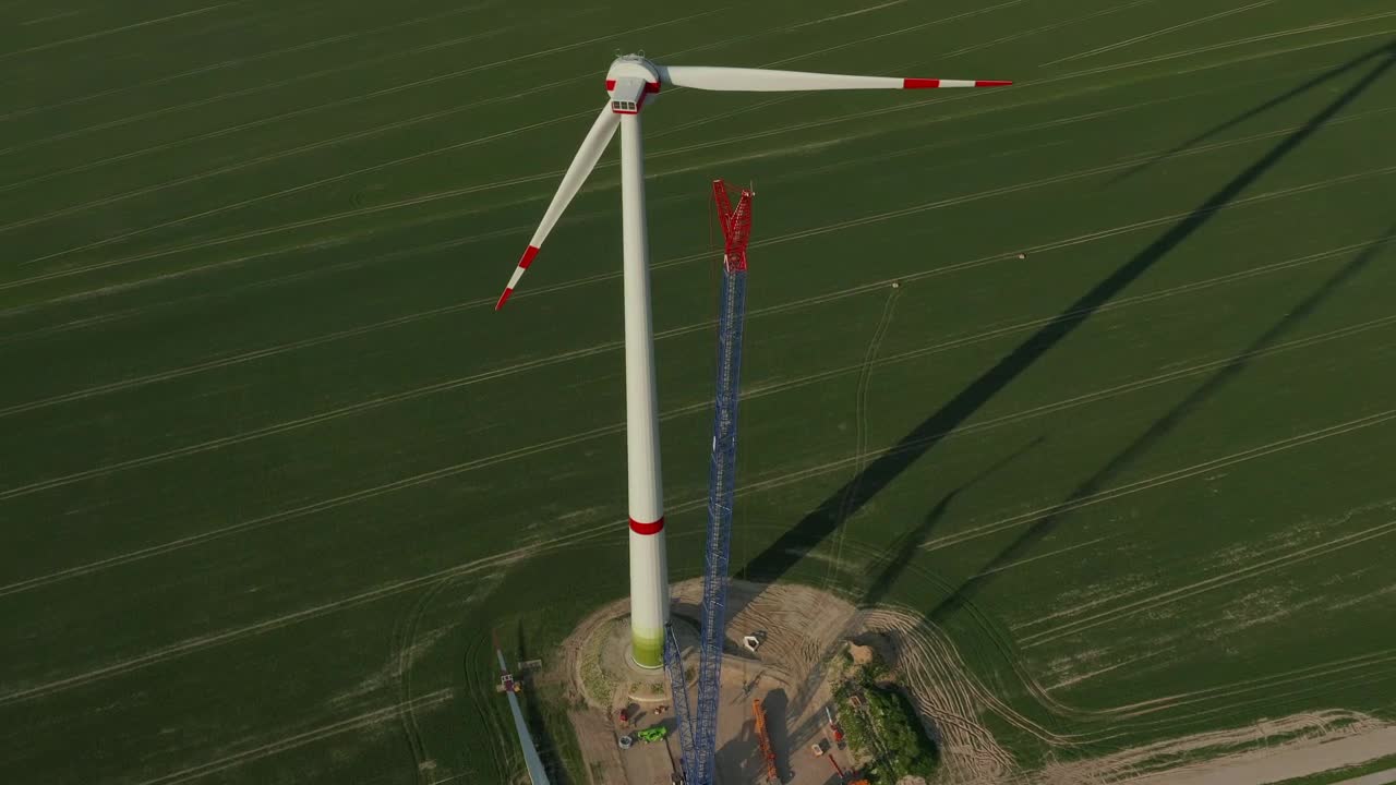 Stock Video Huge Wind Turbine Under Repair Seen From The Air Animated Wallpaper - Free Download