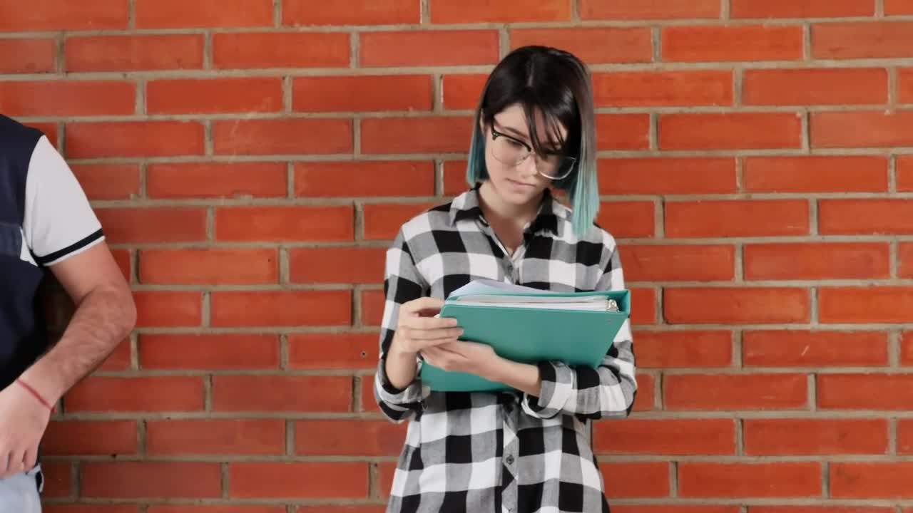 Free Stock Video Two Young People Studying Standing Leaning Against A Wall In Live Wallpaper - Free Download