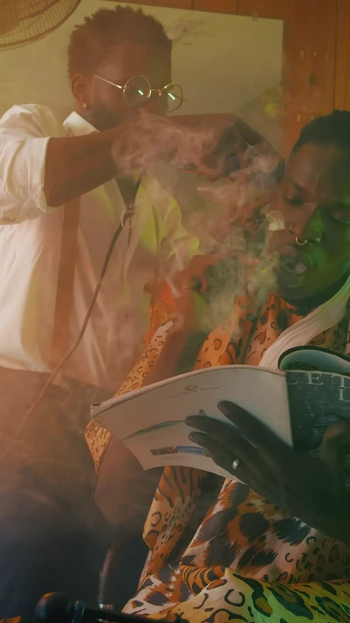 Stock Video Man In A Barbershop Smoking And Reading A Magazine Animated Wallpaper - Free Download