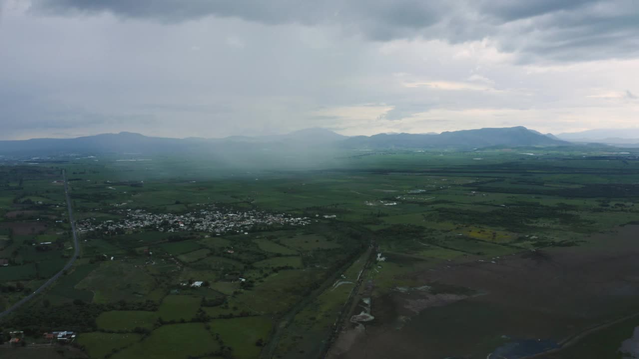 Stock Video Flying Over A Large Plain With A Town Plots And Live Wallpaper For PC - Free Download
