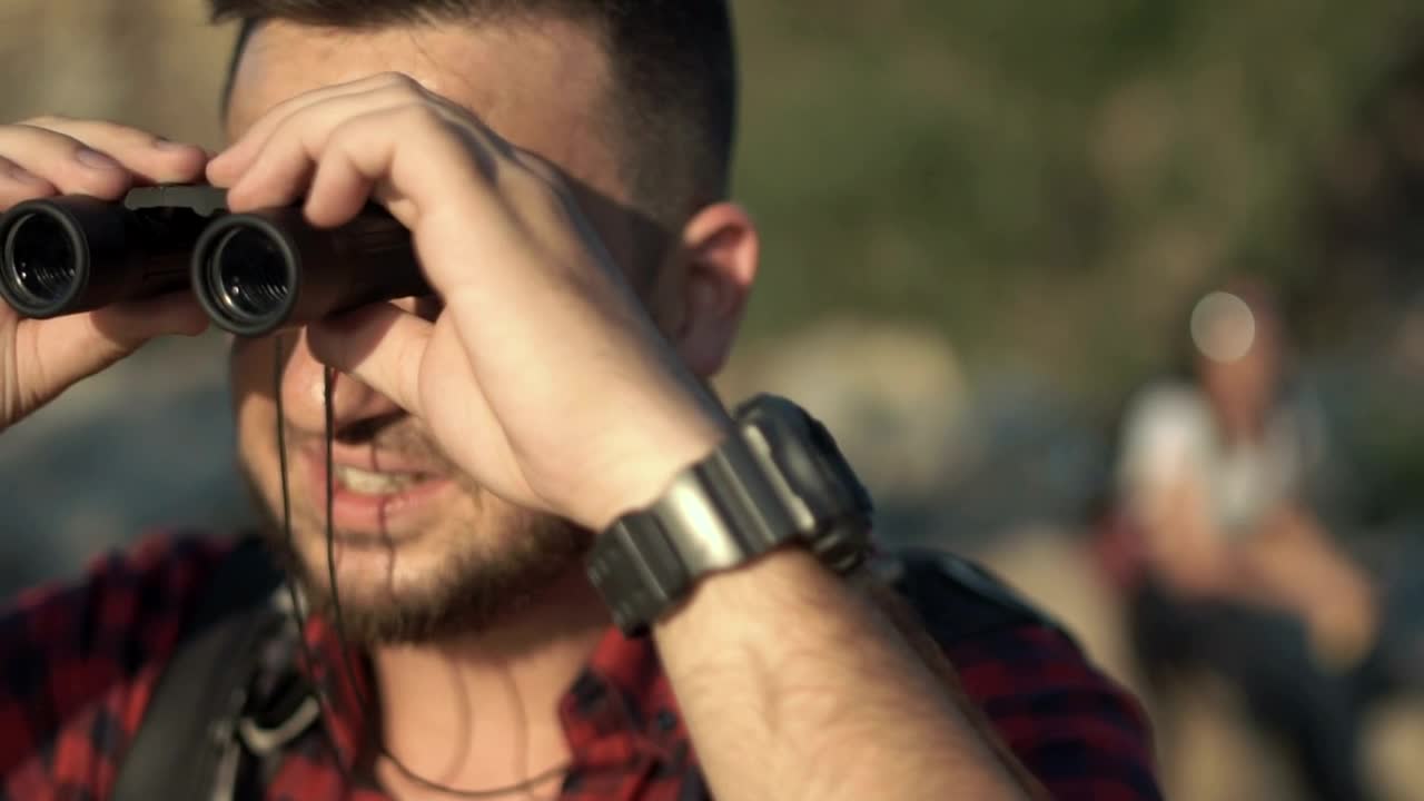 Stock Video Man Using Binoculars And Friends Looking At Ma Animated Wallpaper - Free Download