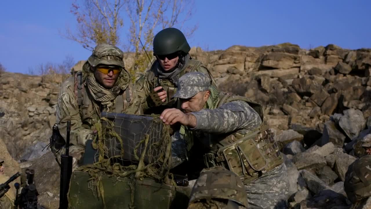 Free Video Stock Soldiers Looking At Computer Outdoors Live Wallpaper - Free Download