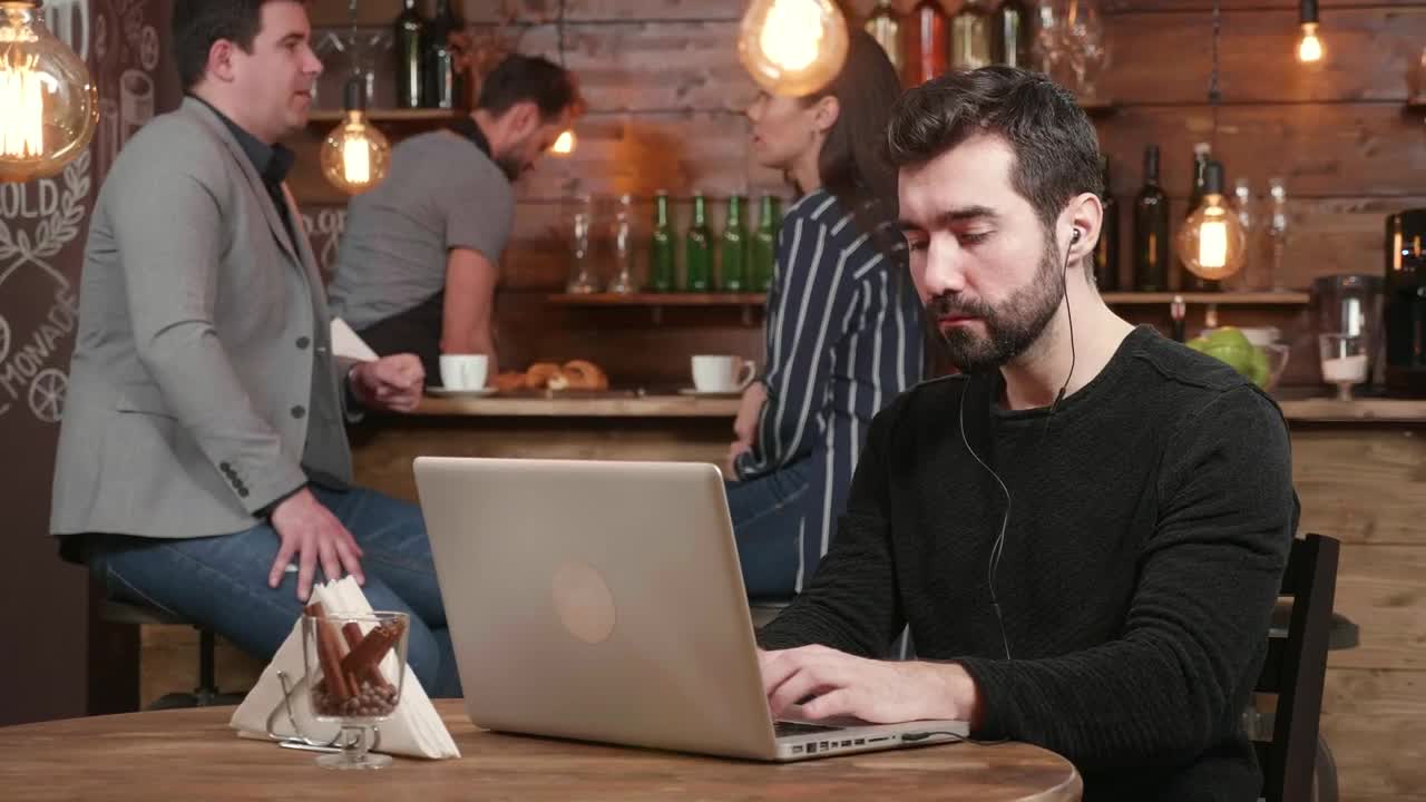 Stock Footage Urban Man Typing On Laptop Is Served Coffee In Hip Live Wallpaper - Free Download