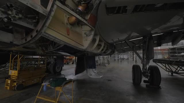 Stock Video Large Aircraft In Maintenance Smal Animated Wallpaper - Free Download
