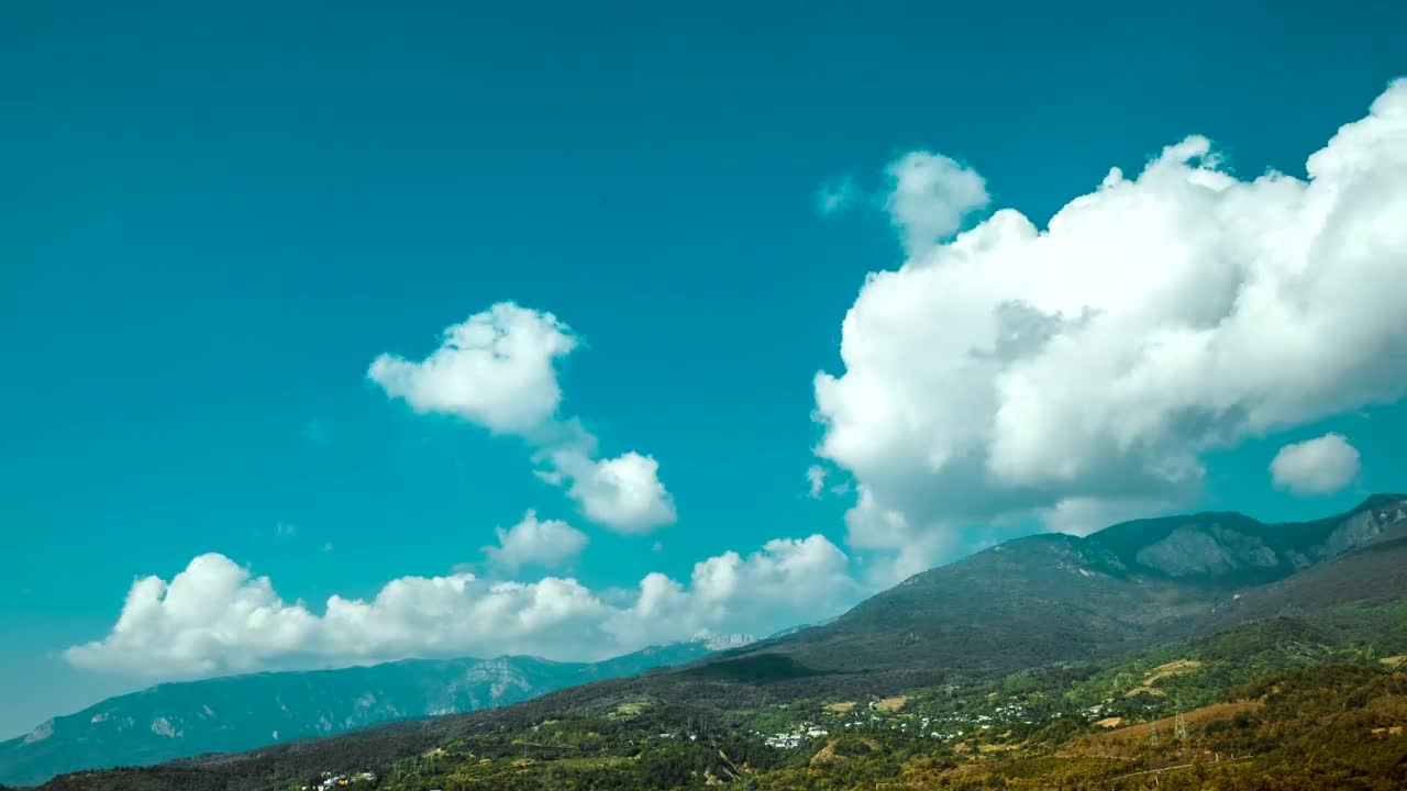 Stock Video Clouds Sweeping Over Tall Hills Live Wallpaper For PC - Free Download