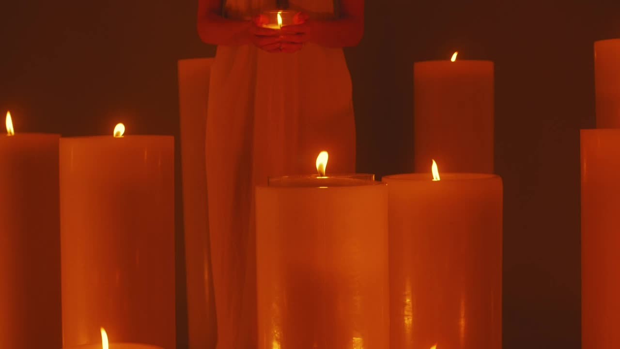 Free Video Stock Spiritual Woman Surrounded By Lots Of Candles Live Wallpaper - Free Download