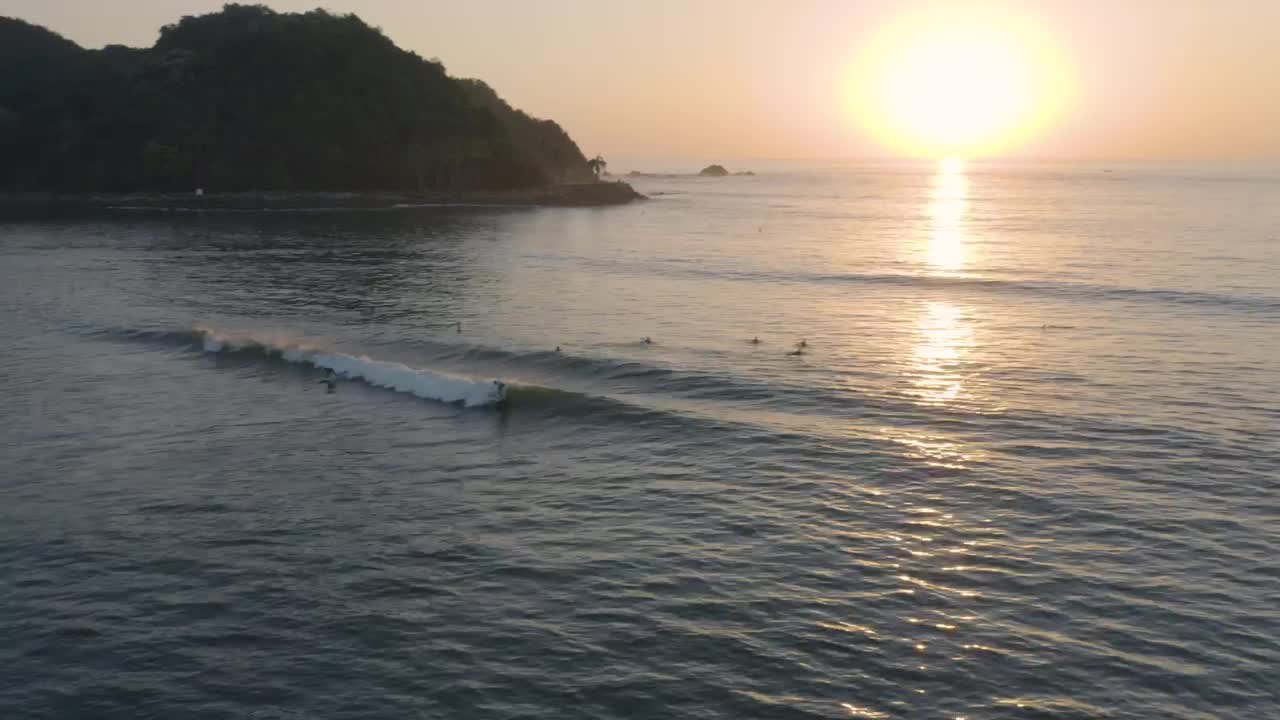 Free Video Stock surfers on waves of a beach from above Live Wallpaper - Free Download