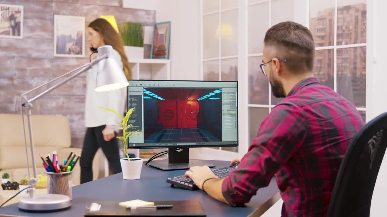 Stock Video Game Developer Working From Home Viewed From Behind Live Wallpaper For PC - Free Download