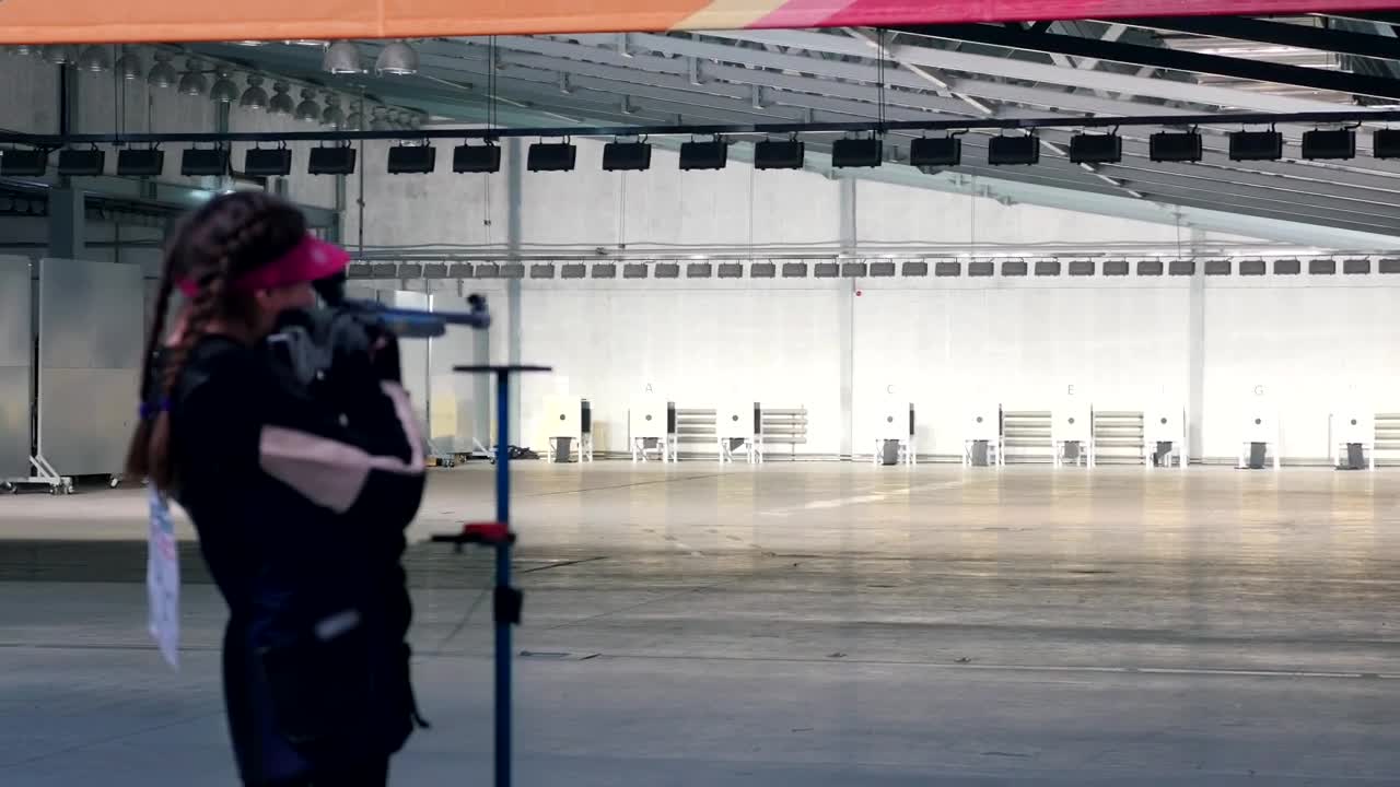 Stock Video Girl Practicing Target Shooting With A Gun Live Wallpaper For PC - Free Download