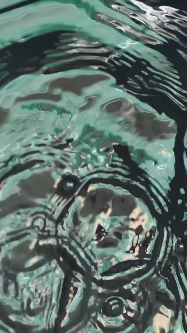 Free Video Stock texture of the water surface when droplets fall on it Live Wallpaper - Free Download