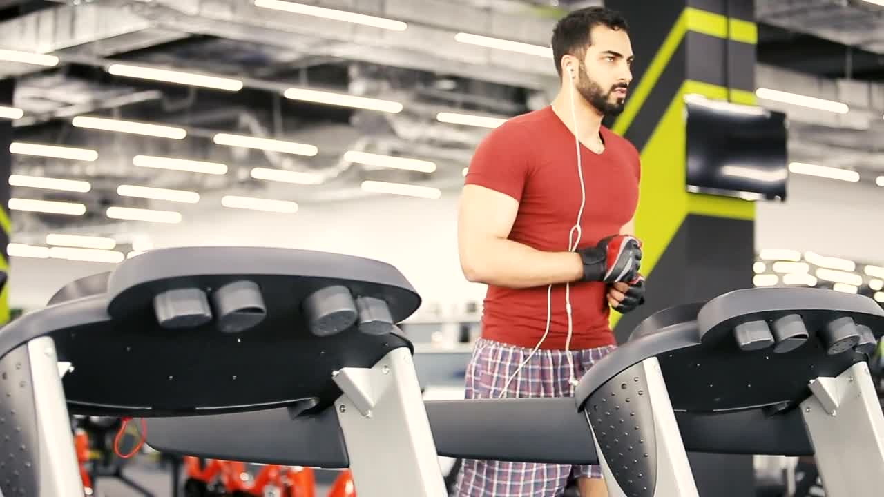 Stock Video Man Runs On Weight Loss Machine In Gy Animated Wallpaper - Free Download