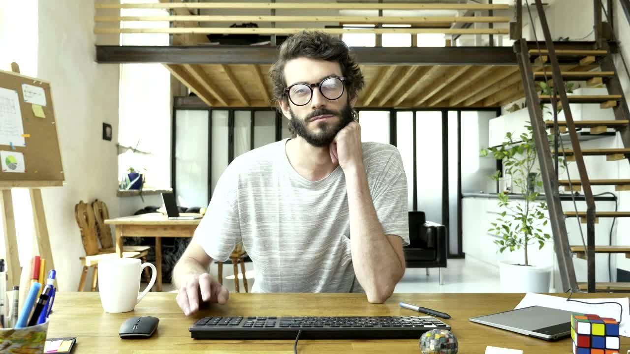 Free Video Stock tired and bored man in front of a computer Live Wallpaper - Free Download