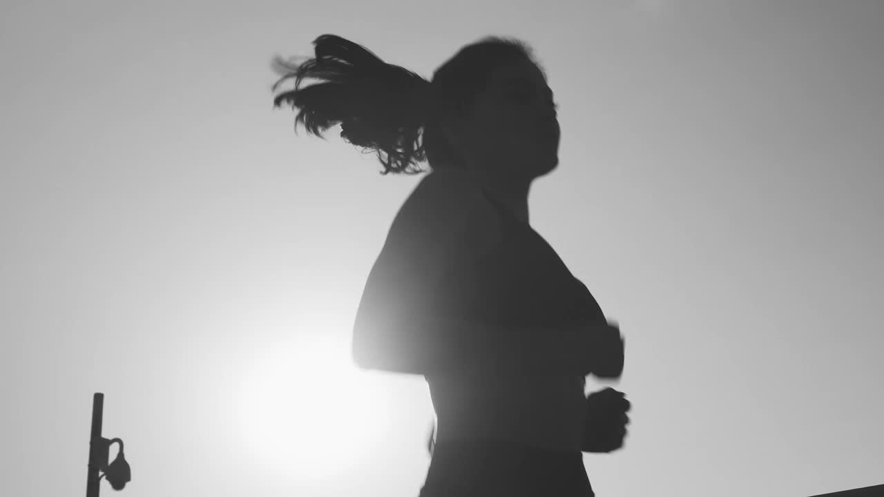 Free Stock Video Silhouette Of A Young Woman Jogging In Front Of The Live Wallpaper - Free Download