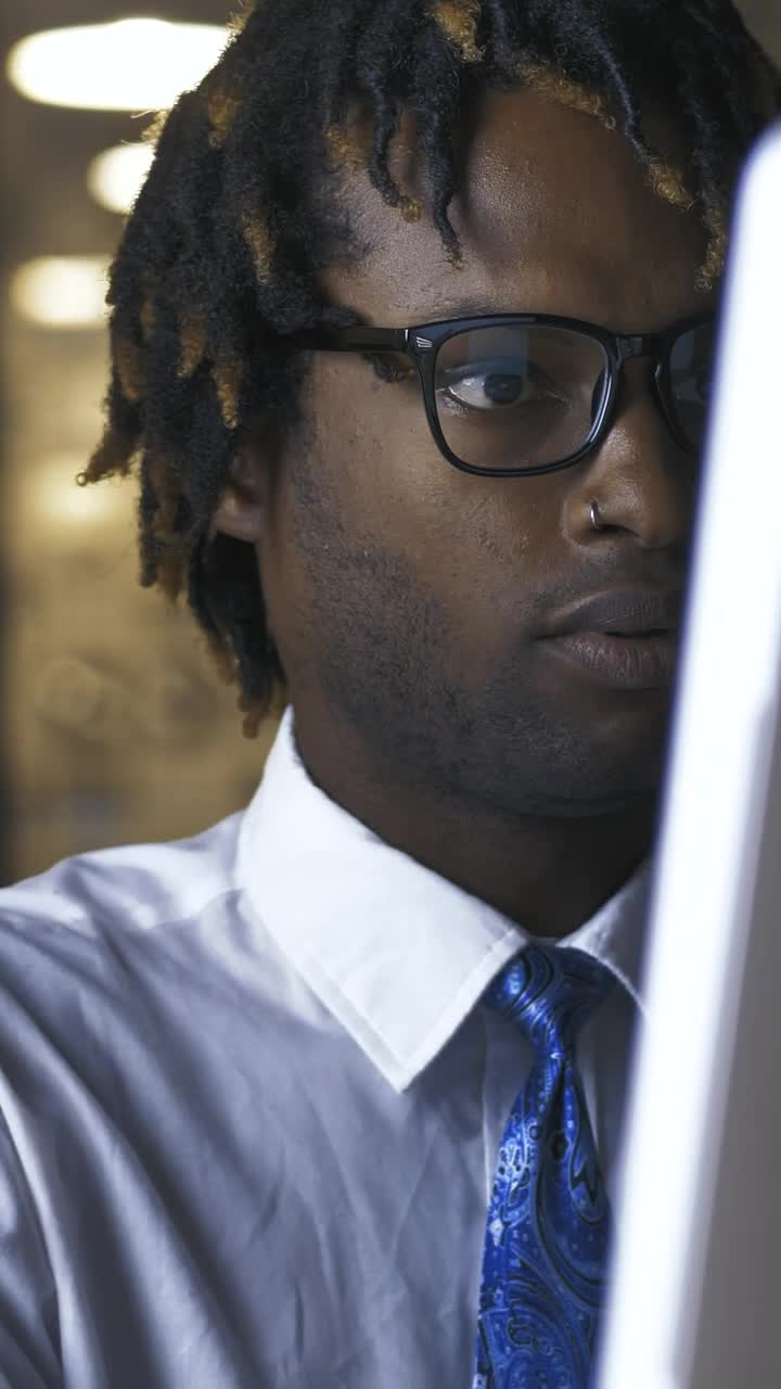 Free Stock Video Young Man Adjusting His Glasses While Working On Computer Live Wallpaper - Free Download