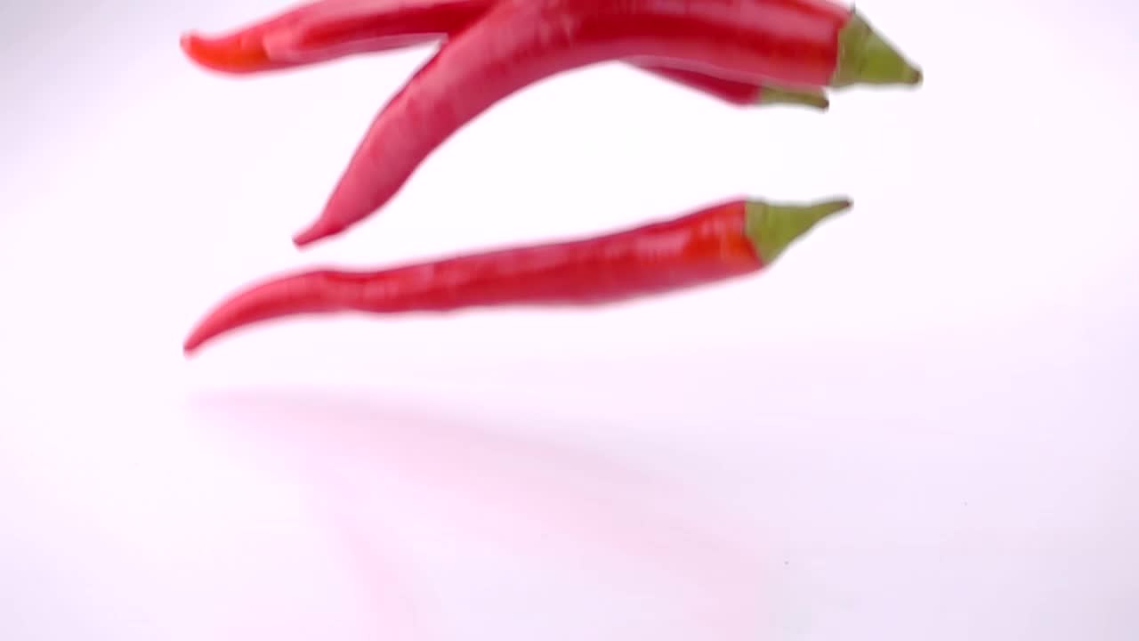Stock Video Fresh Red Chili Peppers Falling Into Water Live Wallpaper For PC - Free Download