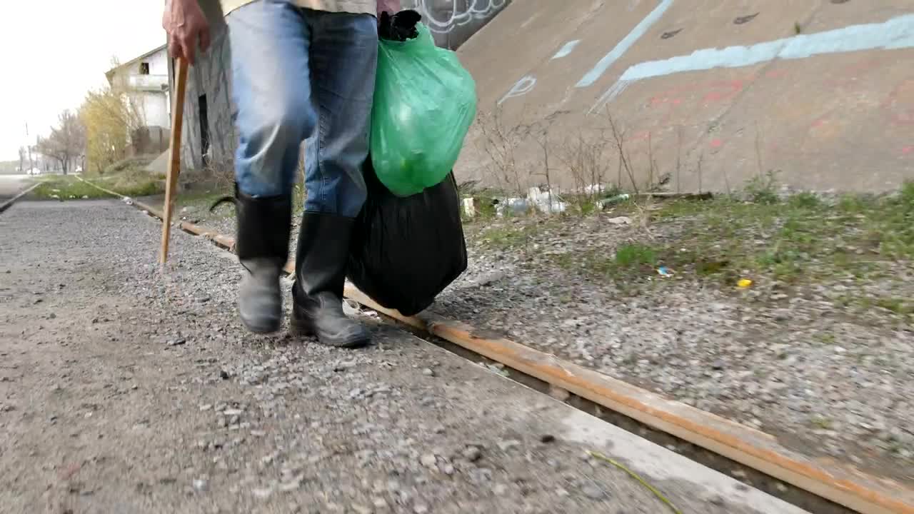Stock Video Homeless Man Collecting Bottles Animated Wallpaper - Free Download