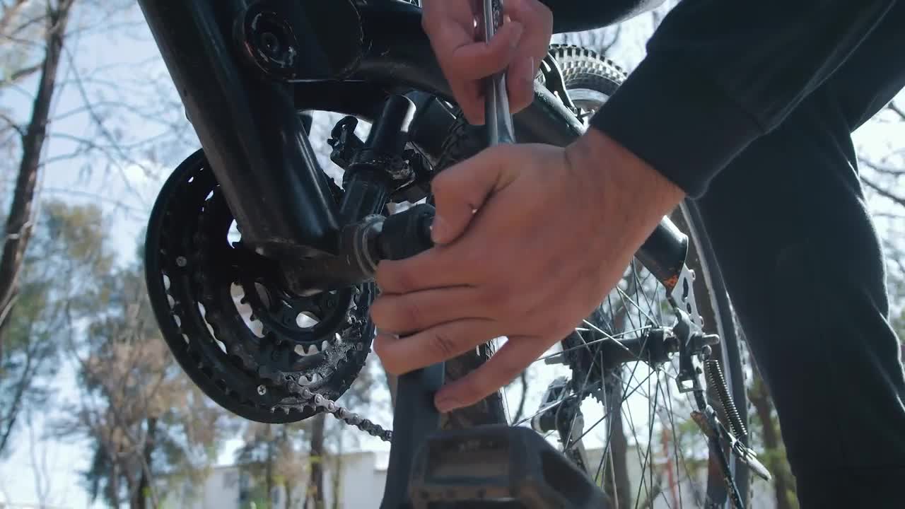 Stock Video Man Adjusting The Pedals Of His Bicycle Animated Wallpaper - Free Download