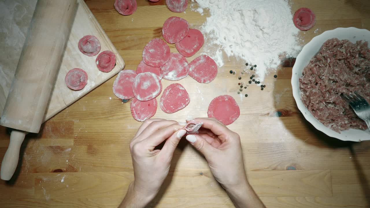 Stock Video Hands Making Red Dumplings On The Table Animated Wallpaper - Free Download