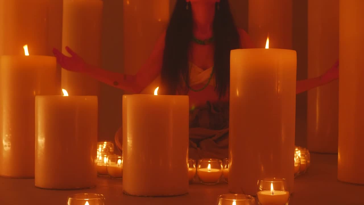 Free Video Stock Spiritual Woman Meditating Surrounded By Many Candles Live Wallpaper - Free Download