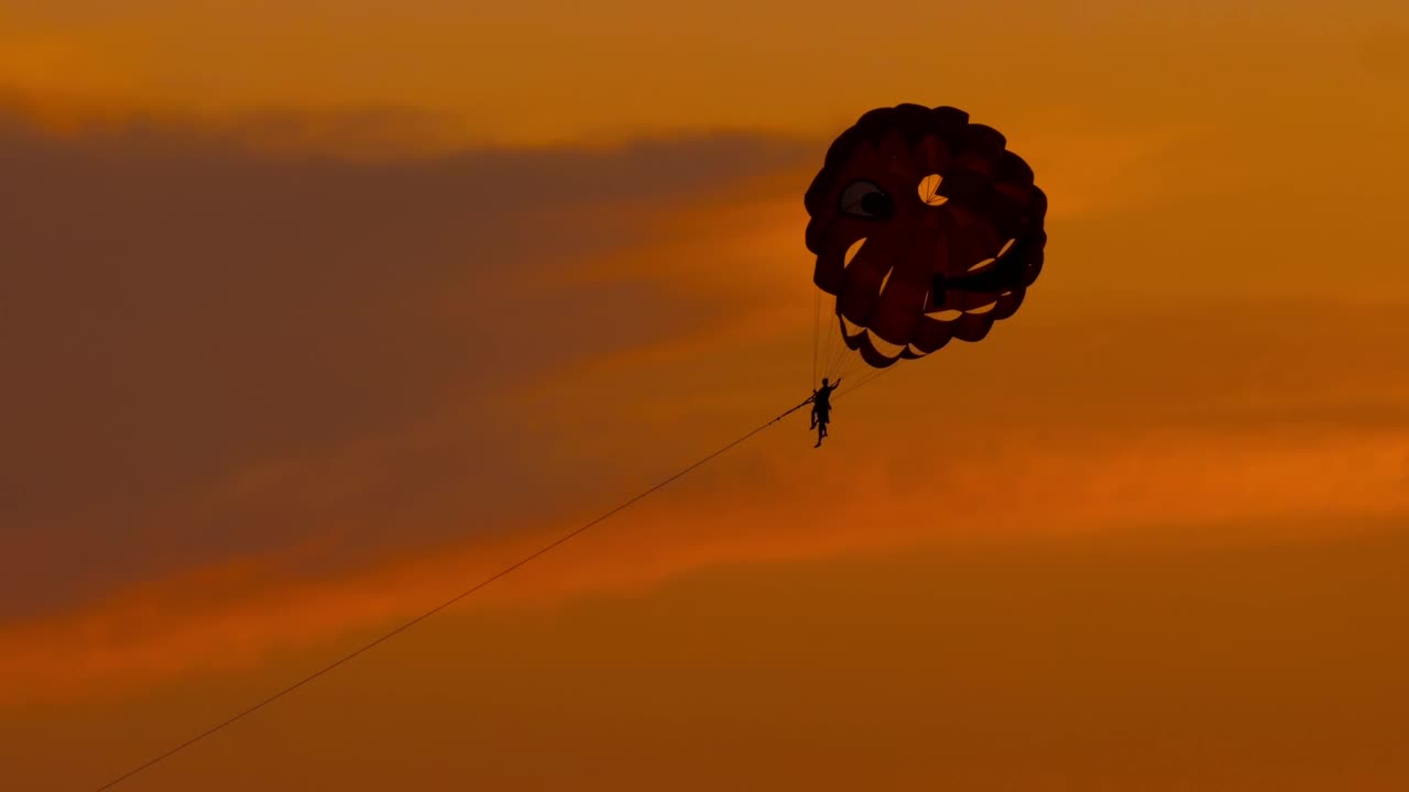 Stock Video Parasailing In An Orange Background Sky Live Wallpaper - Free Download