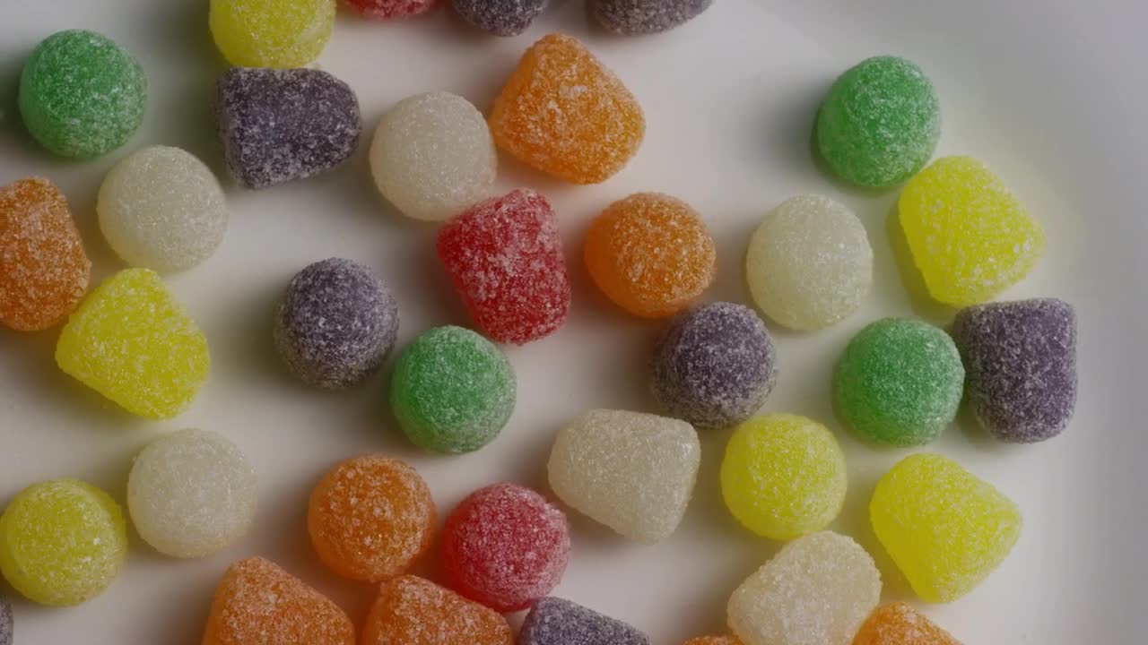 Stock Video Colored Sugary Gums Spinning Slowly Live Wallpaper For PC - Free Download